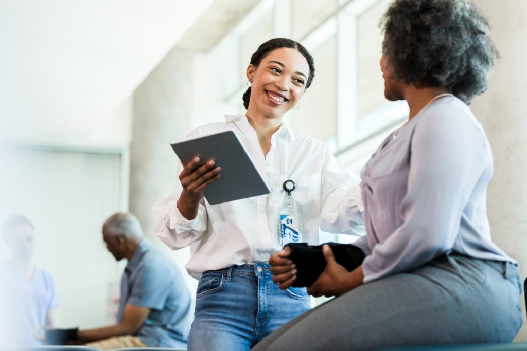 Physical therapist prepares to work with patient